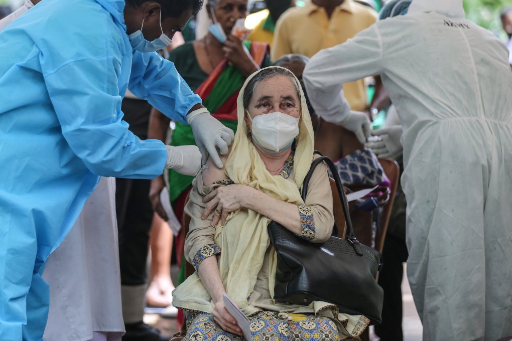 A woman in Sri Lanka receives a Covid-19 vaccine shot in Colombo. Photo: EPA-EFE