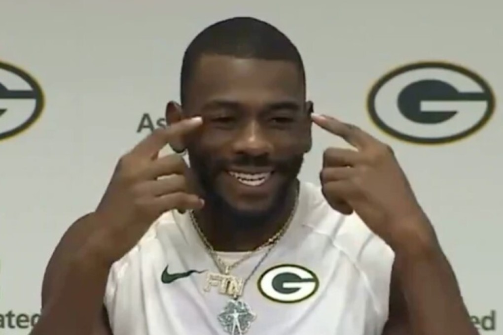 Green Bay Packers player Devin Funchess makes a ‘slant-eyed’ gesture during a press conference. Image: Instagram