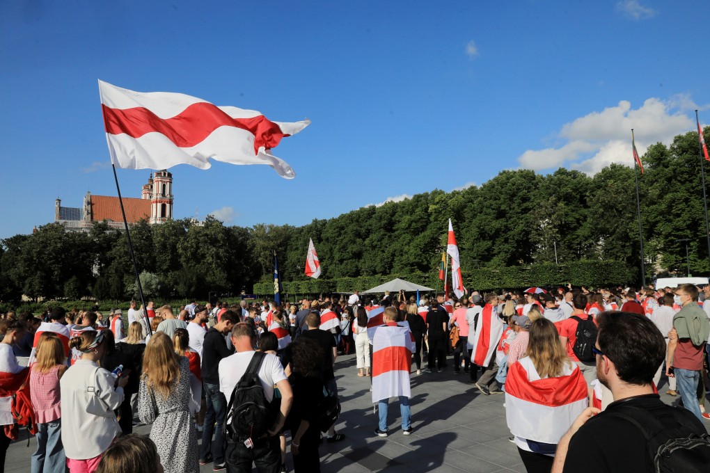 People attend a rally in Vilnius, Lithuania on Monday marking the anniversary of the start of mass demonstrations in Belarus. Photo: EPA-EFE