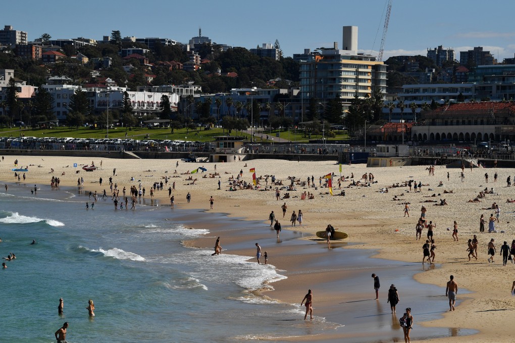 People sunbathe at Bondi Beach in Sydney, Australia. Photo: AAP Image/DPA