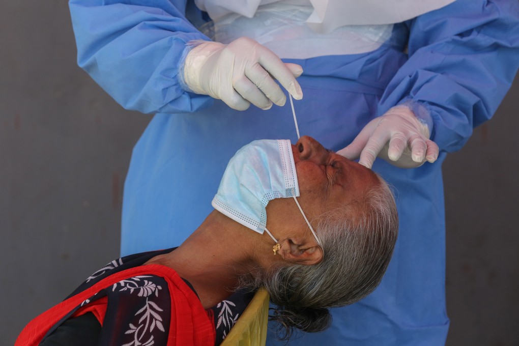 A woman takes a Covid-19 swab test in Colombo, Sri Lanka on August 5. Worldwide coronavirus cases are on track to passing the 300 million mark by early next year, according to the WHO. Photo: EPA-EFE