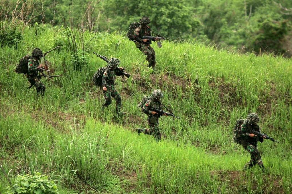 Indonesian army soldiers carry their weapons during a training exercise. The army said ‘virginity tests’ for women recruits had been abolished. Photo: Reuters