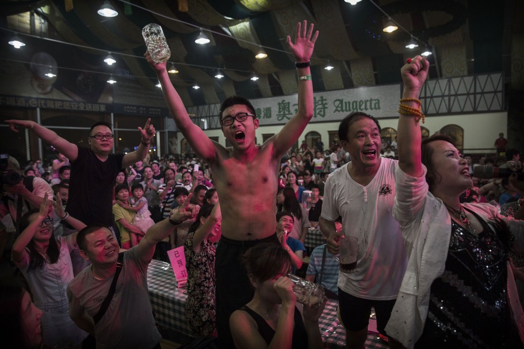 Chinese revellers celebrate during the Annual Qingdao International Beer Festival in China. Photo: Getty