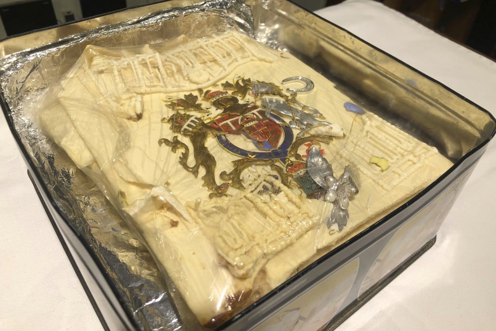 A plastic-wrapped slice from one of the official cakes made for the royal wedding has been kept in its tin for 40 years. Photo: PA via AP