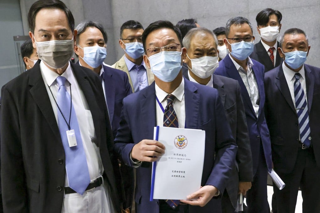 Heung Yee Kuk chairman Kenneth Lau (centre) and other kuk members at the government headquarters in Admiralty for their meeting with Chief Executive Carrie Lam. Photo: May Tse