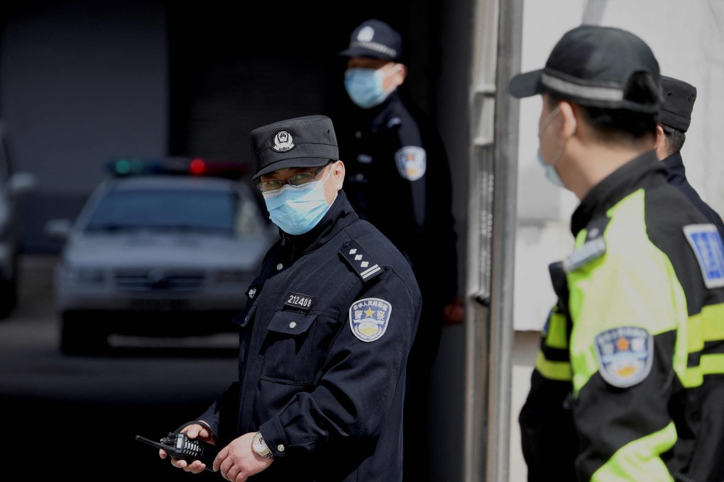 Police vehicles exit the Dandong Intermediate People’s Court, where the trial of Canadian Michael Spavor was held, in China’s northeast Liaoning province on March 19. Photo: AFP