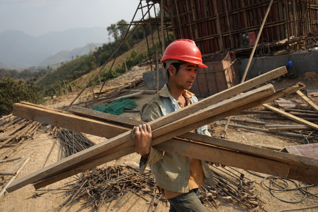 A Chinese worker at the construction site of a railway linking China to Laos. Photo: AFP