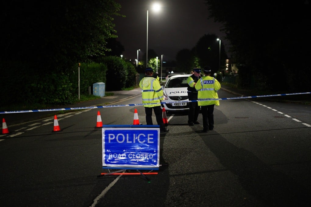 British police form a cordon on Royal Navy Avenue, near the scene of an incident in the Keyham area of Plymouth. Photo: dpa