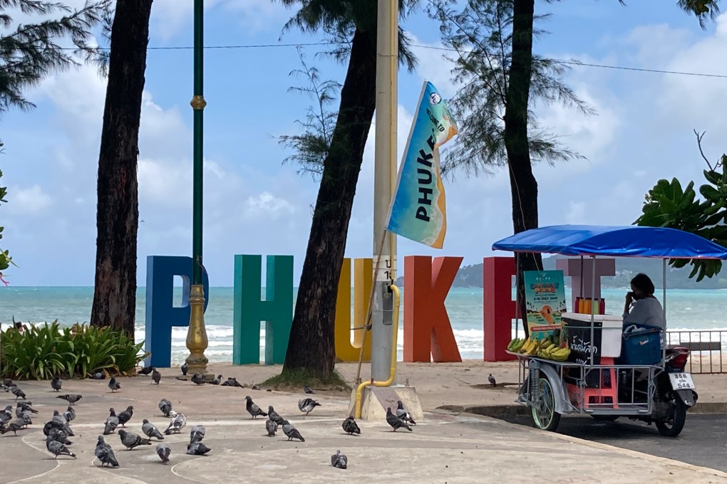 A street food vendor waits for customers in Phuket. Photo: dpa