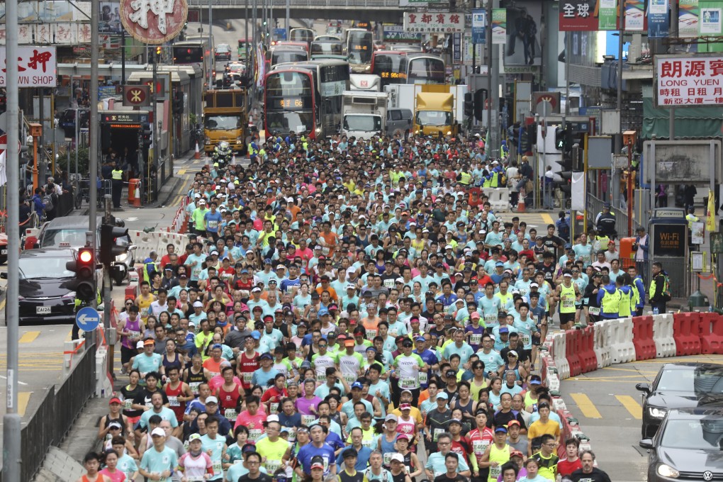 Thousands of runners pass through Nathan Road in Mong Kok during the 2019 Standard Chartered Marathon. Photo: Dickson Lee