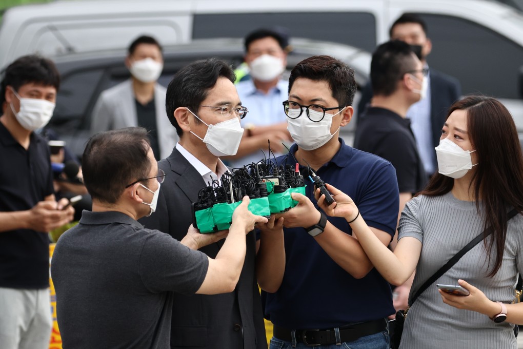 Lee Jae-yong, co-vice chairman of Samsung Electronics, speaks to reporters after being paroled. Photo: Bloomberg