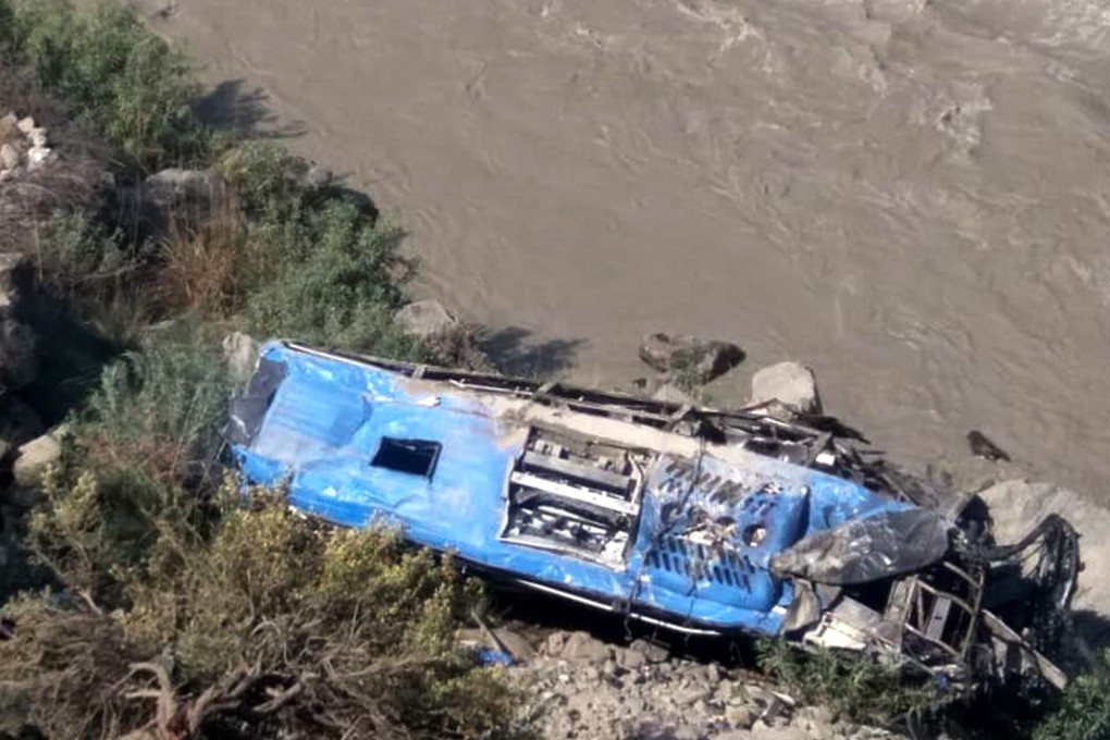 The wreckage of a bus carrying Chinese and Pakistani workers is seen at the bottom of a ravine after the vehicle plunged into it following a blast in Pakistan’s northwest Khyber Pakhtunkhwa province on July 14. Thirteen people were killed, including nine Chinese workers. Photo: Xinhua