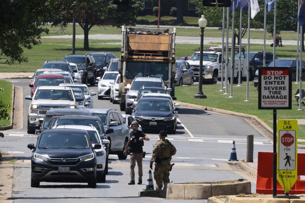 Military police officers direct traffic off Joint Base Anacostia-Bolling after a report of a suspicious armed person on site on Friday. Photo: Reuters