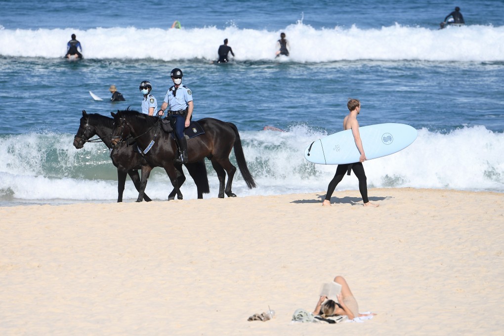 Police patrol Bondi Beach on horseback in Sydney, Australia. Photo: AAP Image/dpa