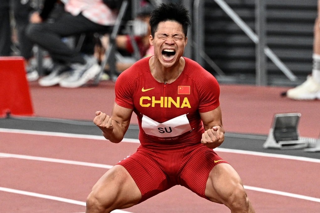 China's Su Bingtian celebrates after winning his men's 100m semi-final at the Tokyo 2020 Olympic Games. Photo: AFP