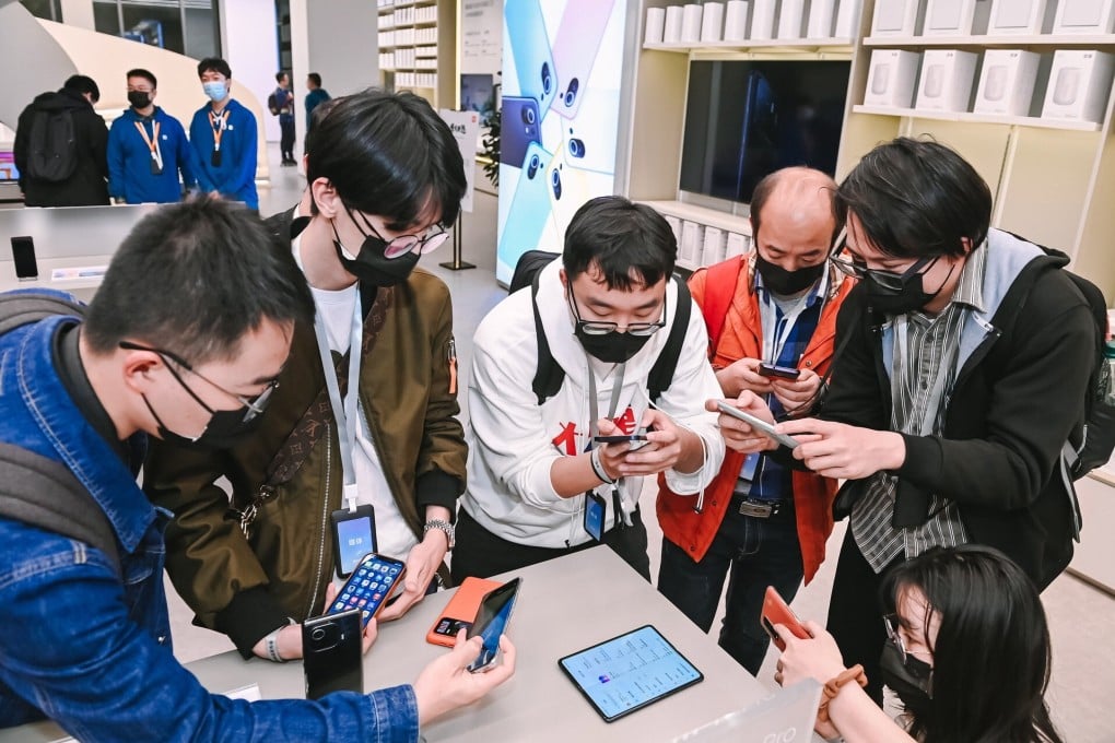 Xiaomi fans check out the company’s foldable smartphone Mi Mix Fold during a launch event in Beijing in March. Photo: Handout/EPA-EFE
