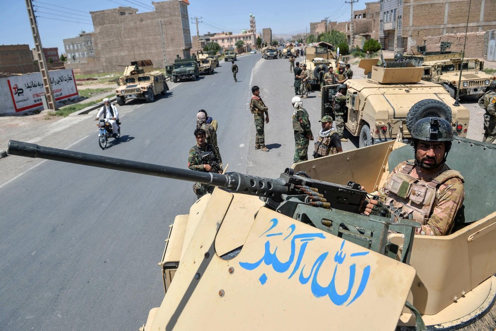 Afghan army soldiers guard a road in Herat province amid skirmishes with the Taliban. Photo: TNS