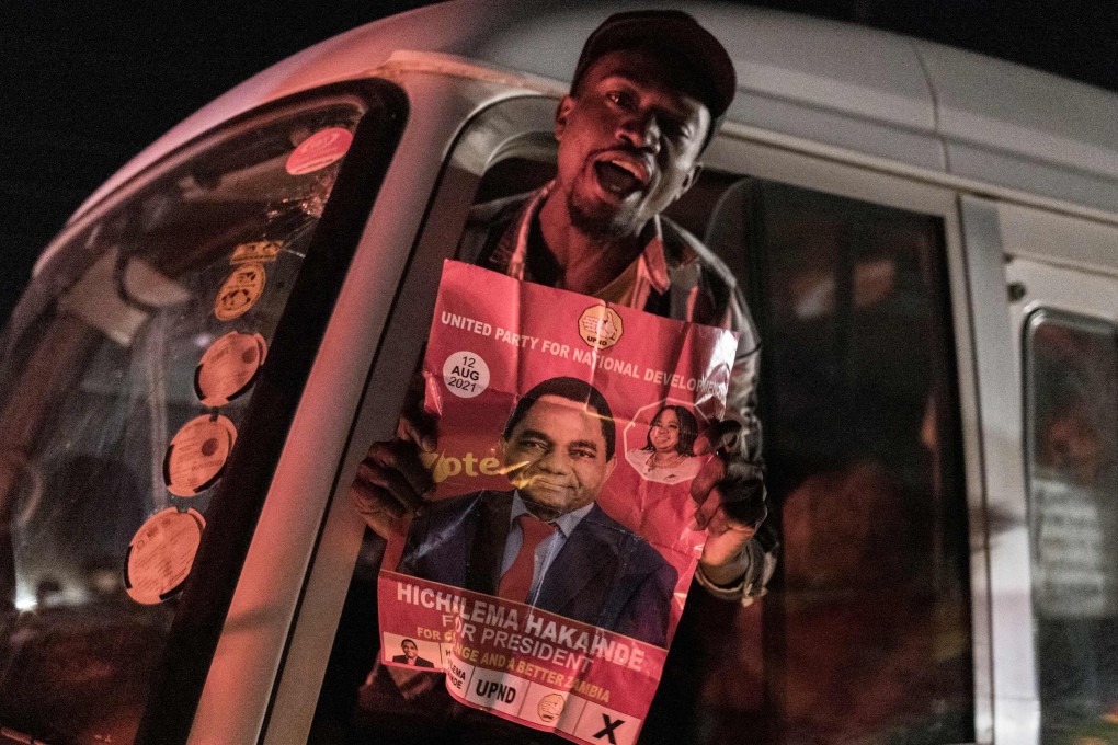 A man with a poster of Hakainde Hichilema, who has been declared Zambia’s next president, in Lusaka on Sunday. Photo: AFP