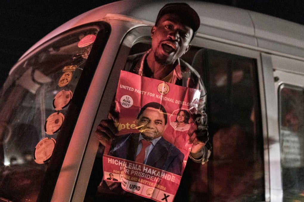 A man with a poster of Hakainde Hichilema, who has been declared Zambia’s next president, in Lusaka on Sunday. Photo: AFP