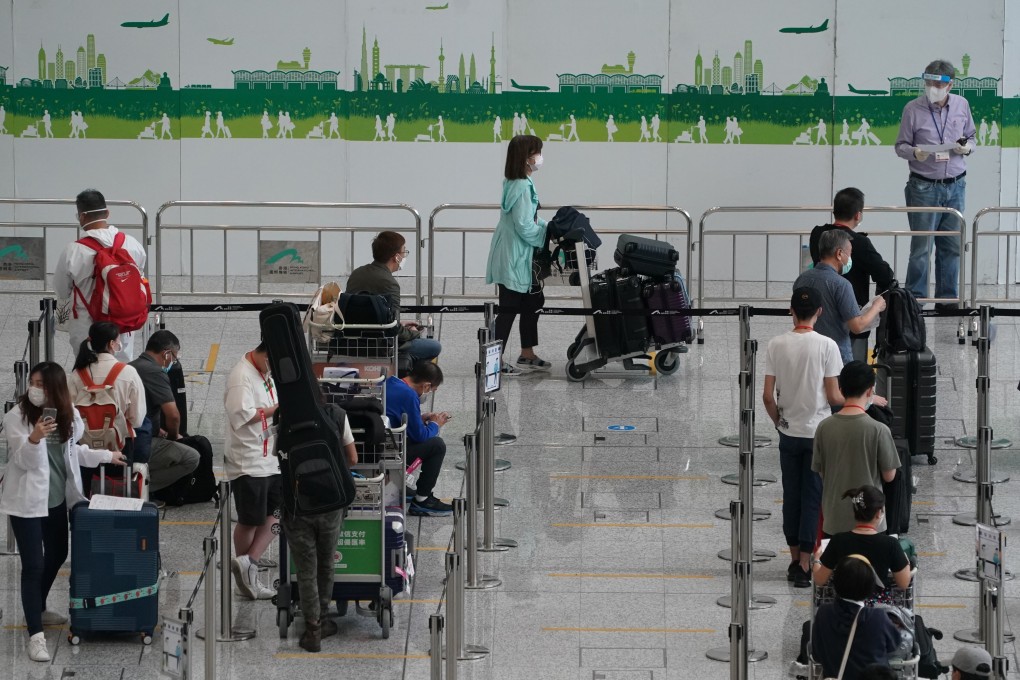 Passengers at Hong Kong International Airport before being transported to designated quarantine hotels in June. Photo: Felix Wong