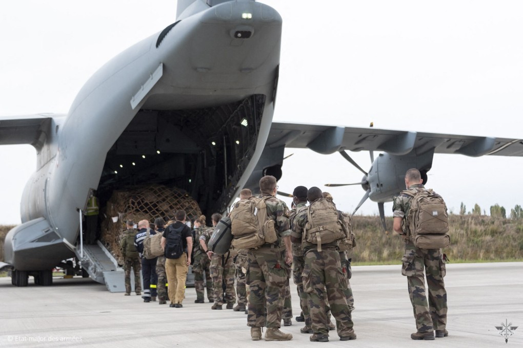 French army members board an aircraft ahead of an operation to evacuate French citizens from Afghanistan. Photo: Etat-major des Armees via AFP
