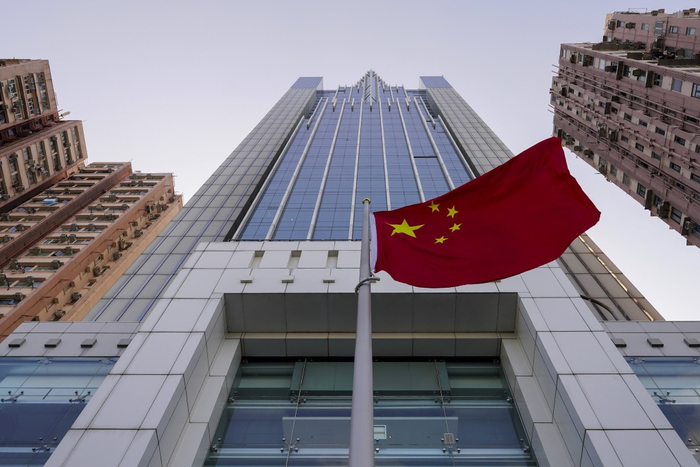 A national flag flutters in the breeze outside the China's liaison office building in Hong Kong. Photo: AP