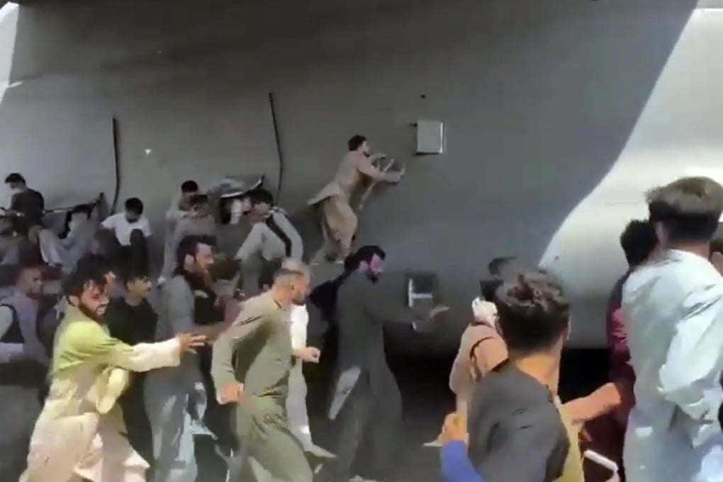 Dramatic video showing Afghans trying desperately to cling on to a US military plane in Kabul made headlines around the world. Photo: AP