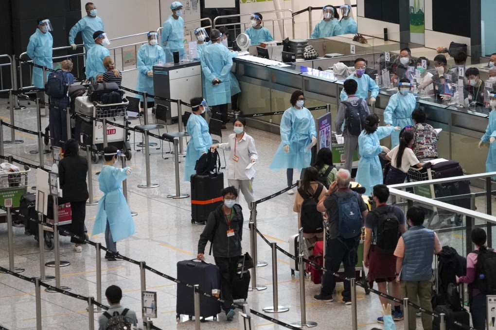 Passengers arrive at Hong Kong International Airport to be transported to designated quarantine hotels in this file photo from June 30 this year. Photo: Felix Wong