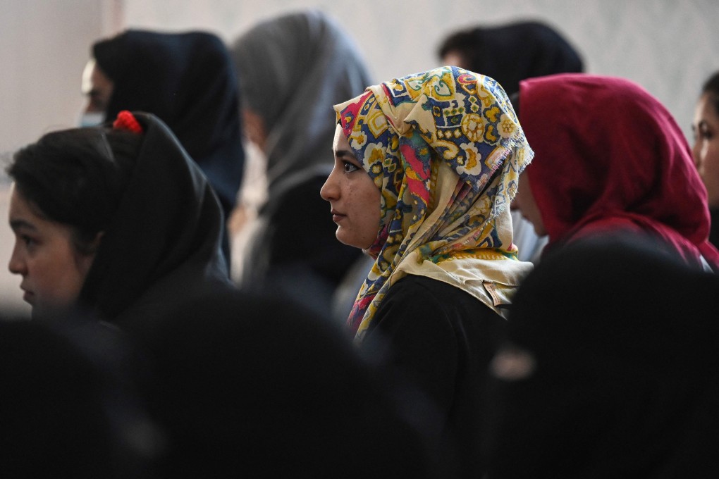 Afghan women take part in a gathering at a hall in Kabul on August 2 over Taliban human rights violations against women. Photo: AFP