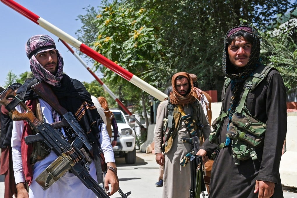 Taliban fighters guard a road near the Zanbaq Square in Kabul after their lightning advance. Photo: AFP
