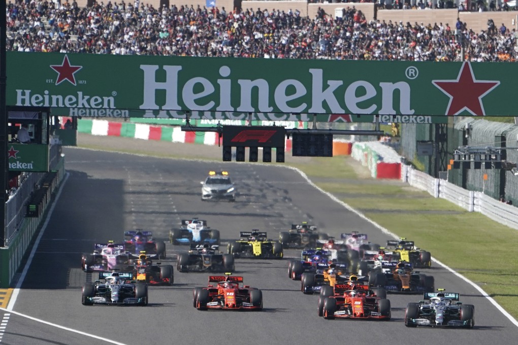 Mercedes driver Valtteri Bottas (right) of Finland passes Ferrari driver Sebastian Vettel of Germany at the start of the 2019 Japanese Formula One Grand Prix at Suzuka Circuit. Photo: AP