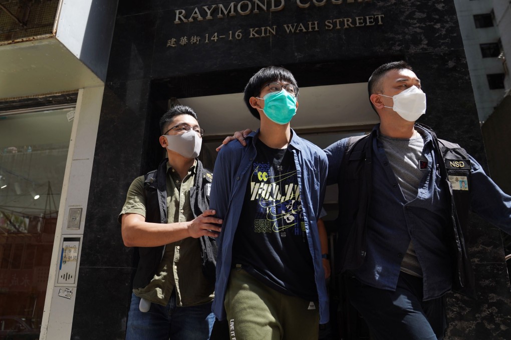 Chris Todorovski, 18, is taken away by national security police on Wednesday morning. Photo: Sam Tsang