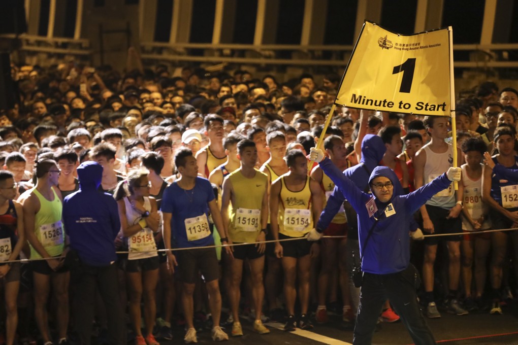 Runners prepare for the start of the 10km Standard Chartered Hong Kong Marathon run in 2019. The event is now set for a return. Photo: SCMP / Felix Wong