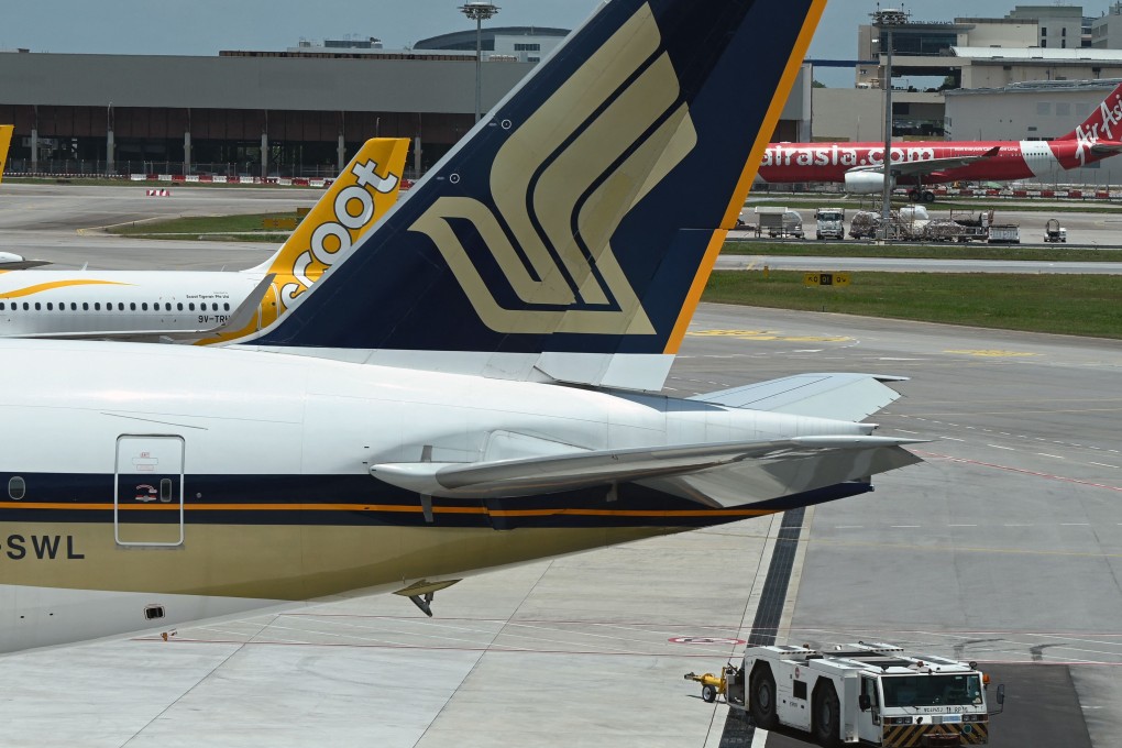 A Singapore Airlines passenger plane parked on the tarmac at Changi Airport. Photo: AFP