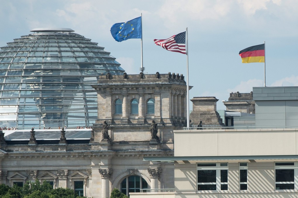 A view of the US embassy with the US flag showing the German Reichstag building in the background in Berlin, Germany. File photo: EPA