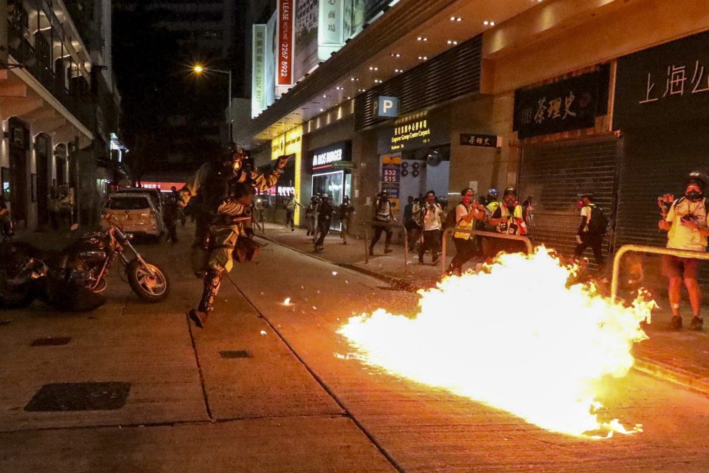 Anti-government protesters throw petrol bombs in Wan Chai on November 2, 2019. Photo: Felix Wong