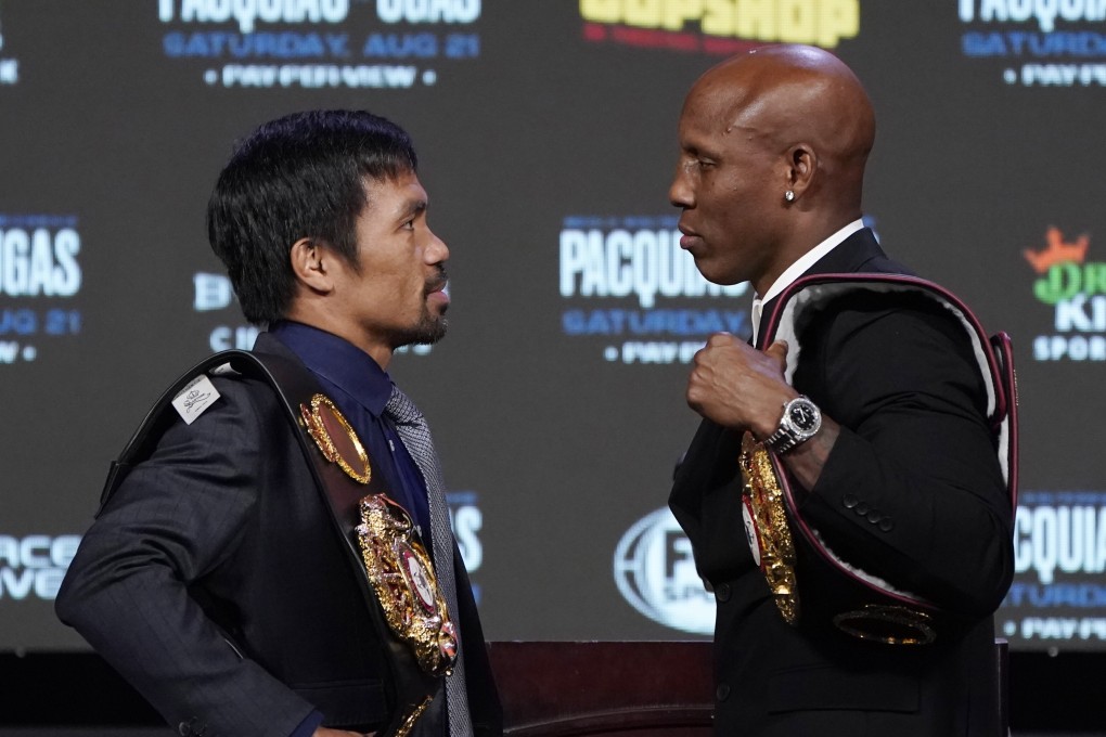 Manny Pacquiao (left) and Yordenis Ugas pose for photographers during a news conference in Las Vegas. Photo: AP