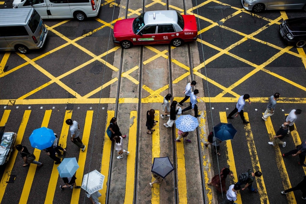 Pedestrians in Hong Kong. Photo: AFP
