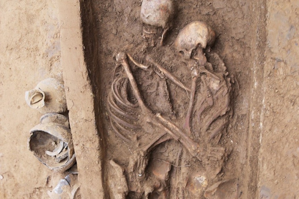 Two skeletons unearthed in north China appear to be in a lover’s embrace. Researchers found a band on the woman’s ring finger. Photo: Xinhua