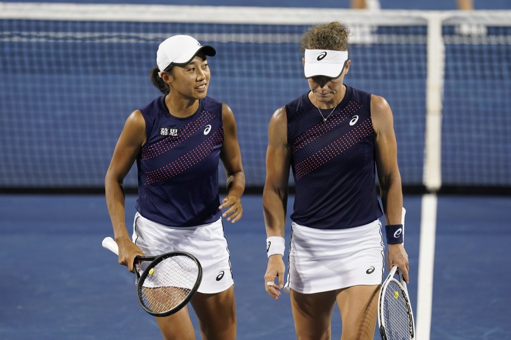 Zhang Shuai of China and Samantha Stosur of Australia talk during the women's doubles final against Gabriela Dabrowski of Canada, and Luisa Stefani of Brazil at the Western & Southern Open. Photo: AP