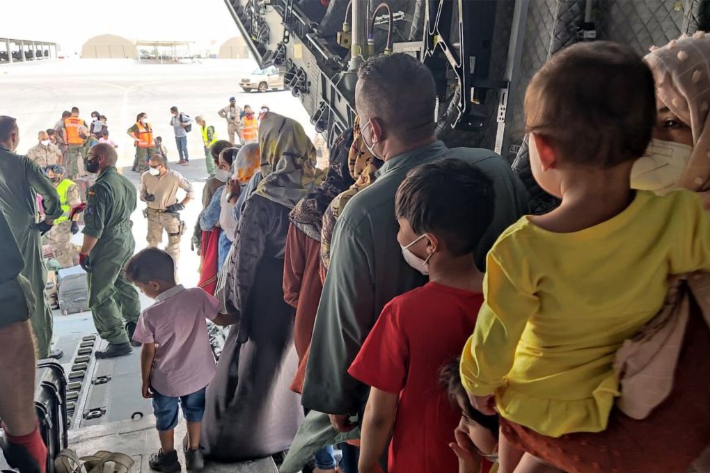 Afghan collaborators with the Spanish mission in Afghanistan and their families arrive in Dubai, UAE before flying to Spain on Friday. Photo: Spanish Ministry of Defence / AFP