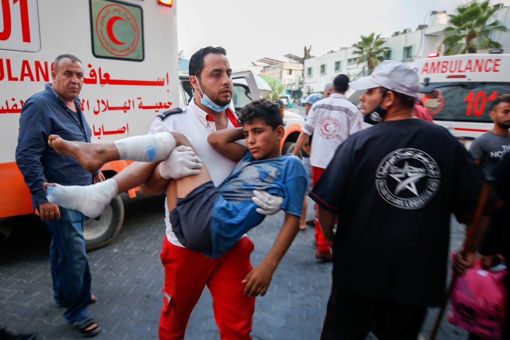 A wounded Palestinian after taking part in a protest at the Israel-Gaza border east of Gaza City on Saturday. Photo: Reuters