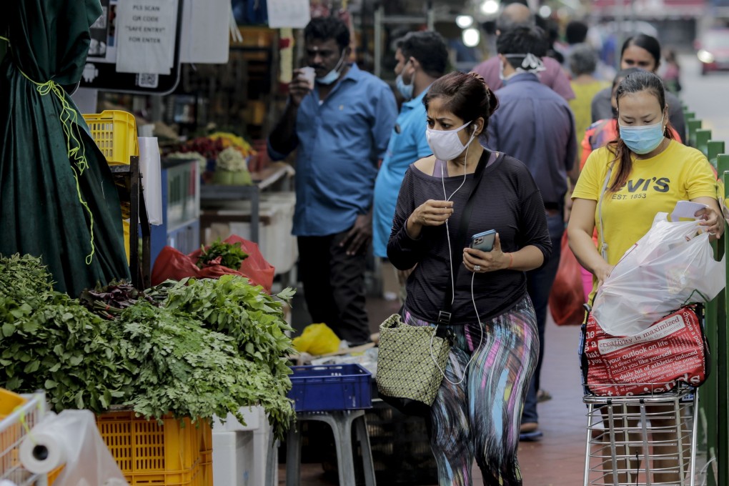 Shoppers at a market in Little India. Photo: EPA-EFE