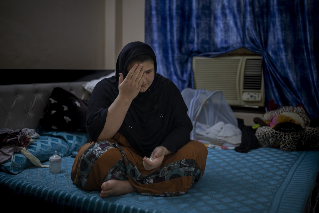 Refugee and former Afghan policewoman Khatera Hashmi sits inside a rented flat in New Delhi. The Taliban shot her and gouged out her eyes, resulting in her fleeing to India last year. Photo: AP