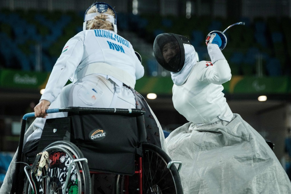 Hong Kong's Justine Charissa Ng (right) competes with Hungary’s Zsuzsanna Krajnyak during the women's épée team semi-final at the Rio 2016 Paralympic Games. Photo: AFP