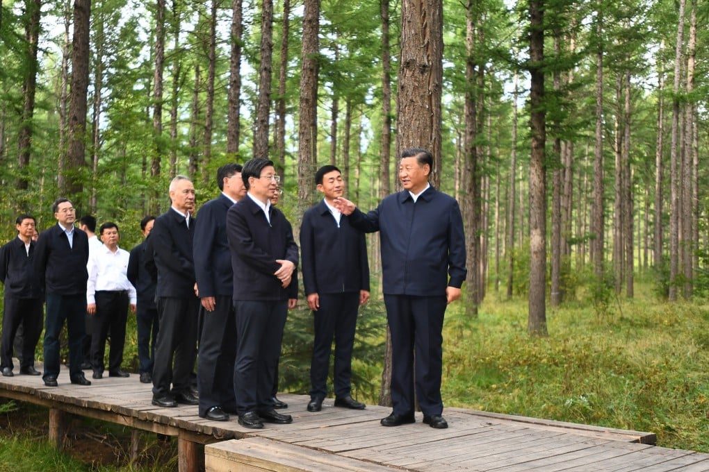Chinese President Xi Jinping checks the growth of trees and learns about the promotion of the “Saihanba spirit” at a forest farm in Hebei province on Monday. Photo: Xinhua