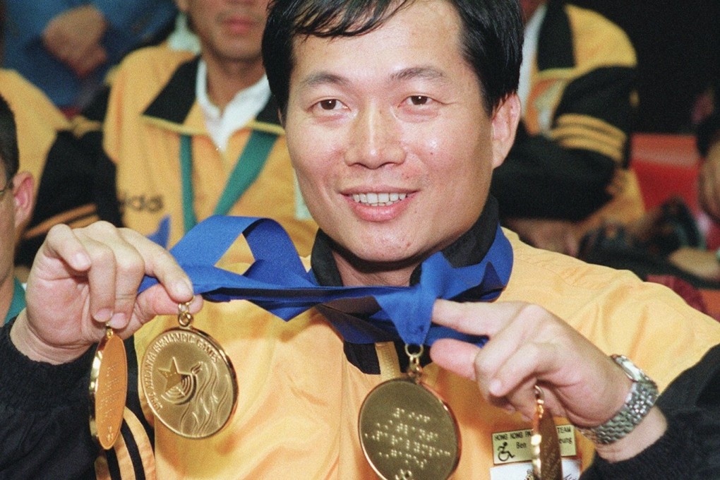 Ben Cheung Wai-leung holds his four Paralympic gold medals upon his return to Hong Kong from the 1996 Atlanta Games. Photo: SCMP