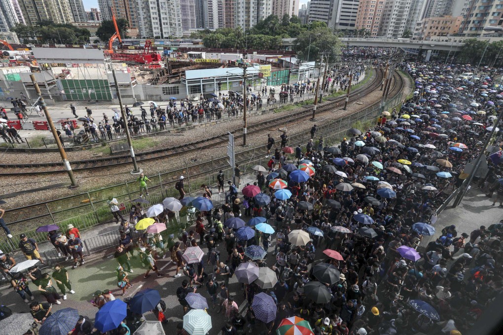 Protesters gather alongside the train tracks in Yuen Long on July 27, 2019. Photo: Xiaomei Chen