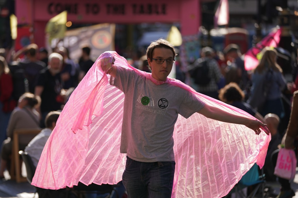 A protester takes part in an Extinction Rebellion rally in London on Monday. Photo: PA / DPA