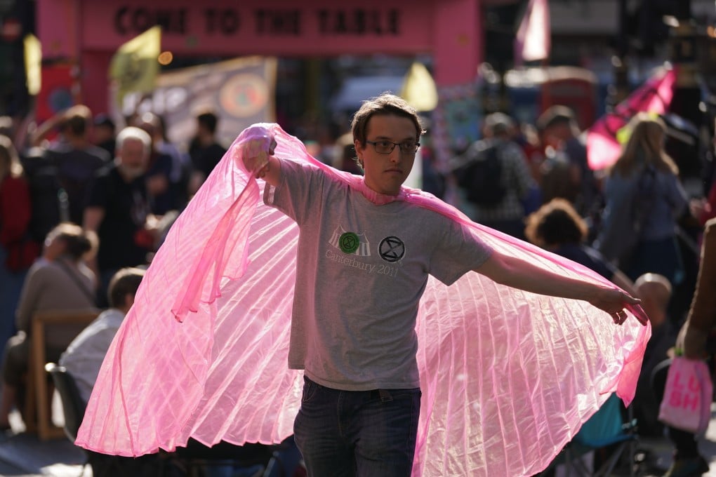 A protester takes part in an Extinction Rebellion rally in London on Monday. Photo: PA / DPA